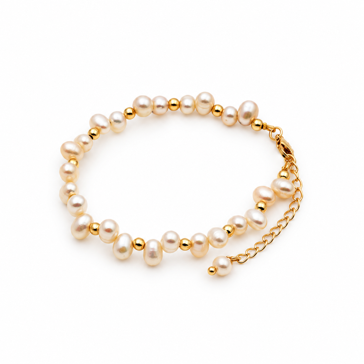 Irregular white pearl bracelet with gold-tone spacer beads and a pearl-tipped extension chain.