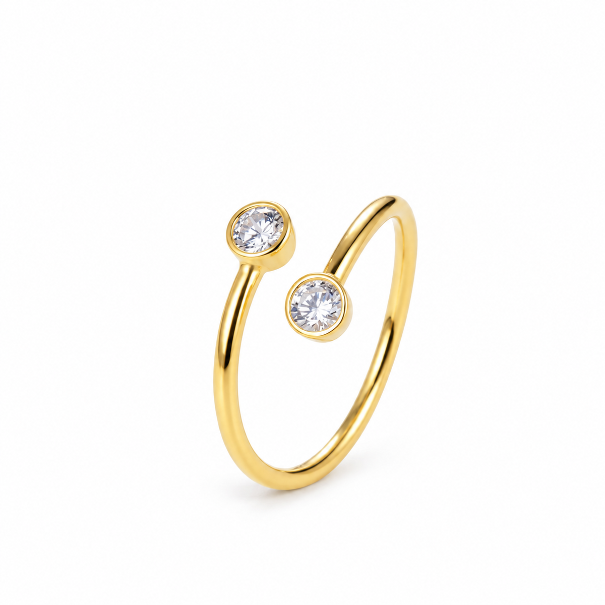 Fine open gold-tone ring with a small round clear stone at each end.