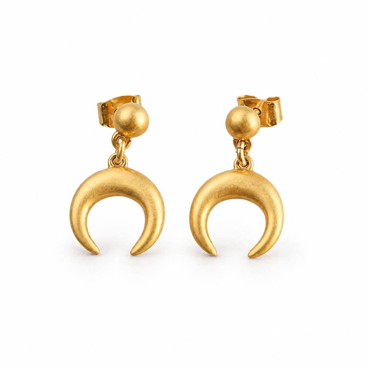 A pair of brushed gold-tone crescent drop earrings with round studs on white.